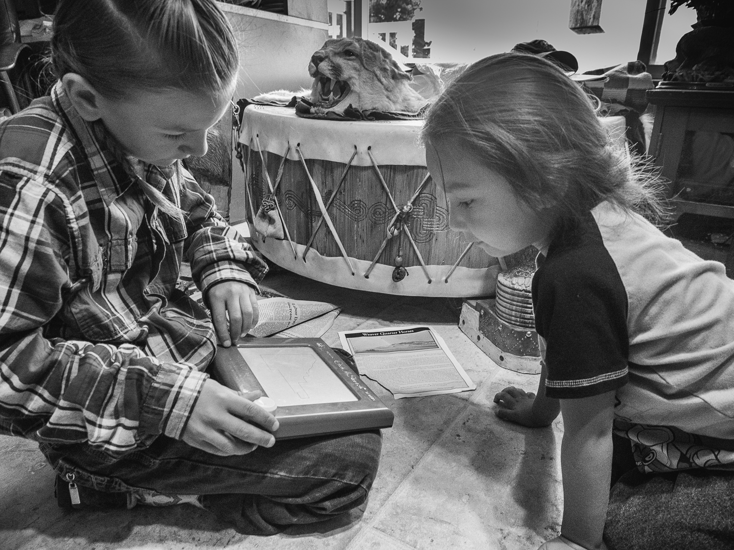 sue_reynolds_leo_and_rylee_playing_etch_a_sketch_blackfeet_reservation_mt_2016.jpg